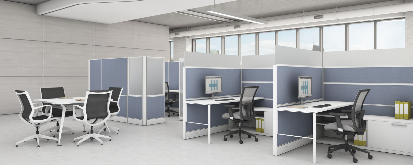 Modern office setup with desks, chairs, and partition walls.