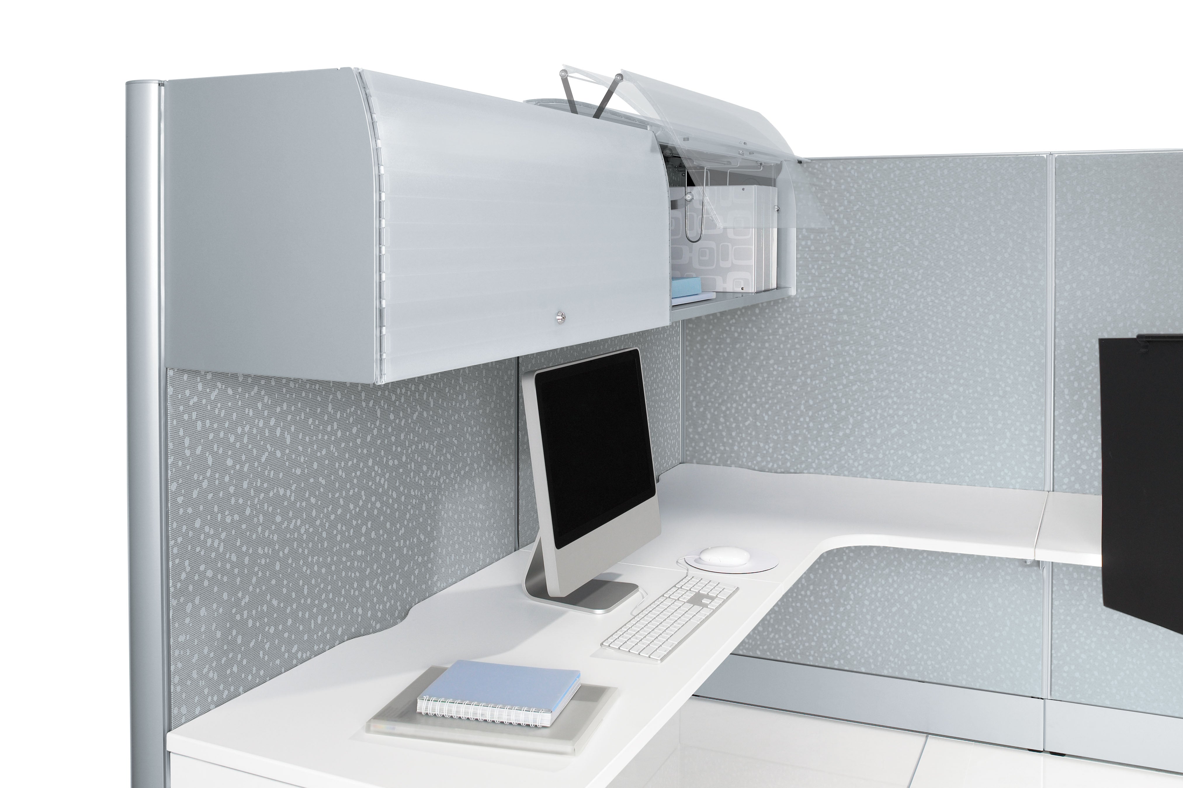 Modern office desk with computer setup and partitioned office space