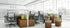 Modern office setup with desks, chairs, and cubicles in a bright room.