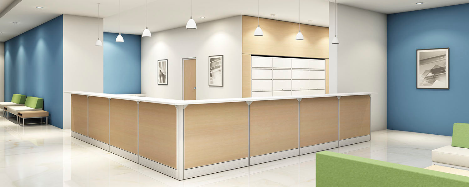 Modern office reception area with a reception desk, chairs, and wall art.